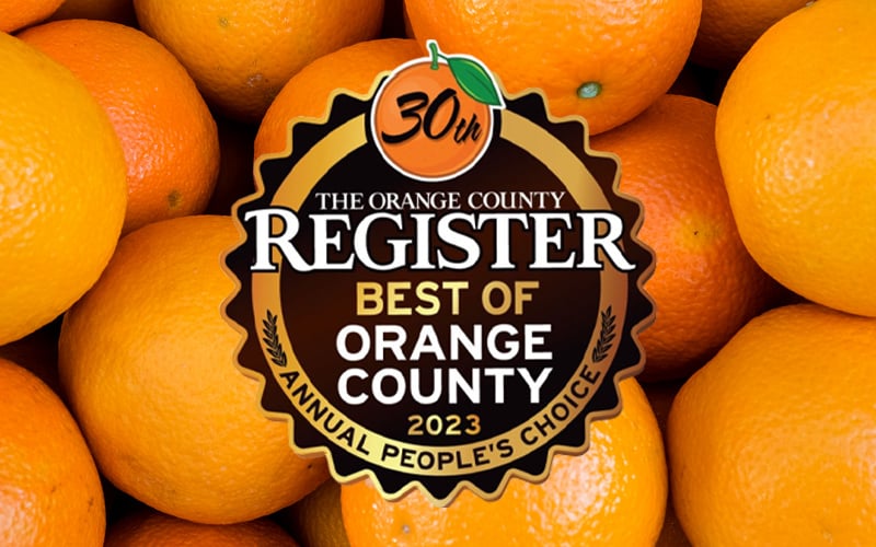 Best of OC logos from past years on background or orange citrus fruit