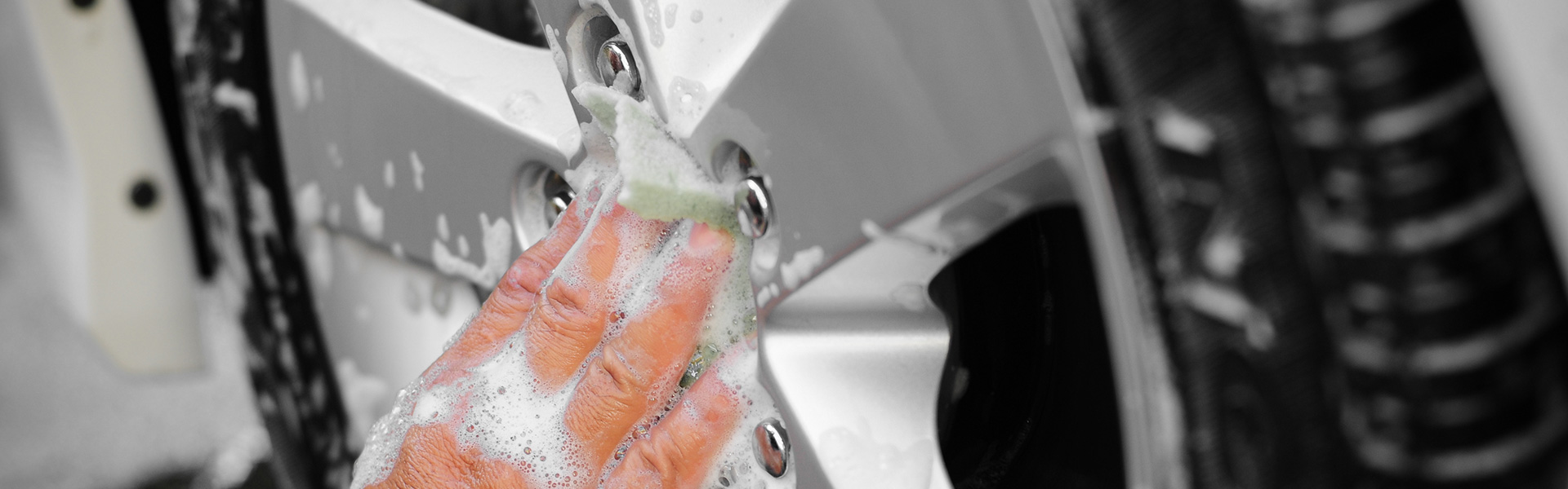 hand washing a car tire