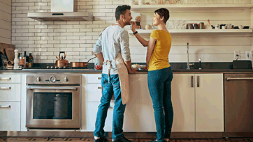 Photo of a couple enjoying their kitchen