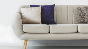 White Couch with Purple Pillow