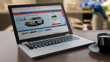 Laptop with autoland website on screen for car shopping