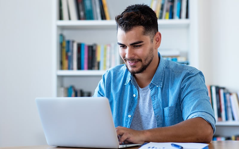 Man working on his laptop from home