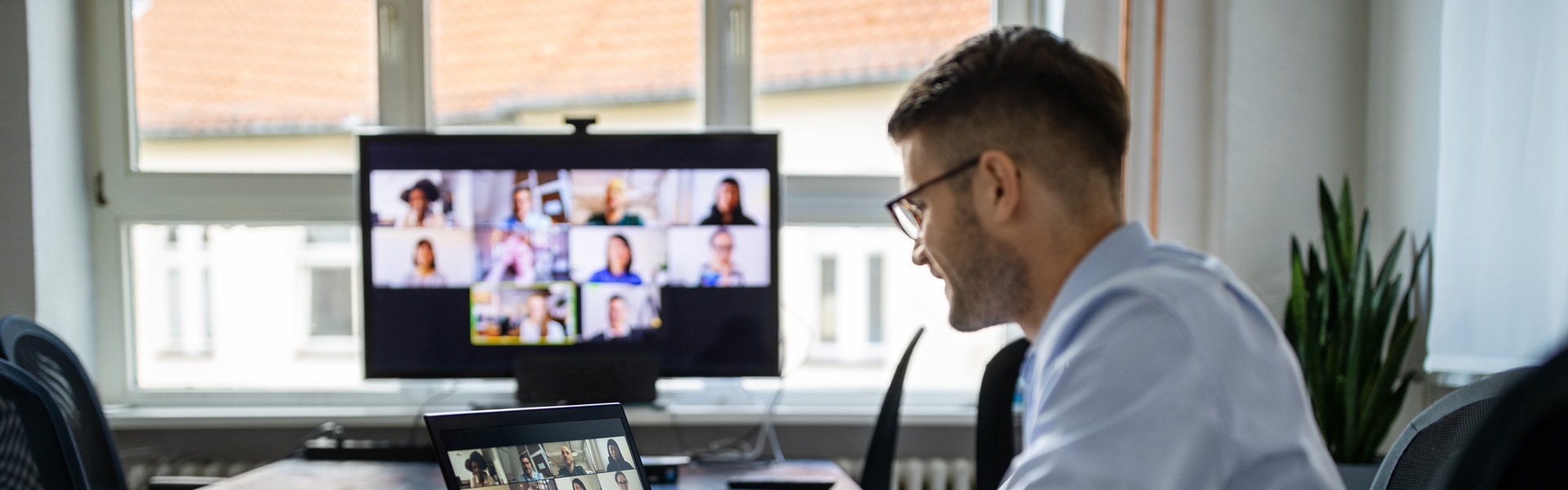 Man working from home on a virtual meeting