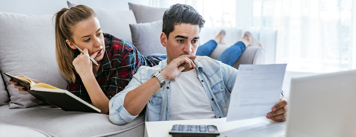 Young couple reviewing financial documents