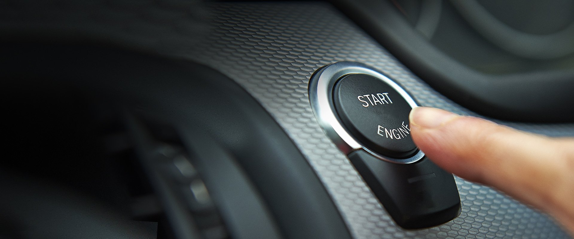 Vehicle push to start button on car financed at Orange County's Credit Union