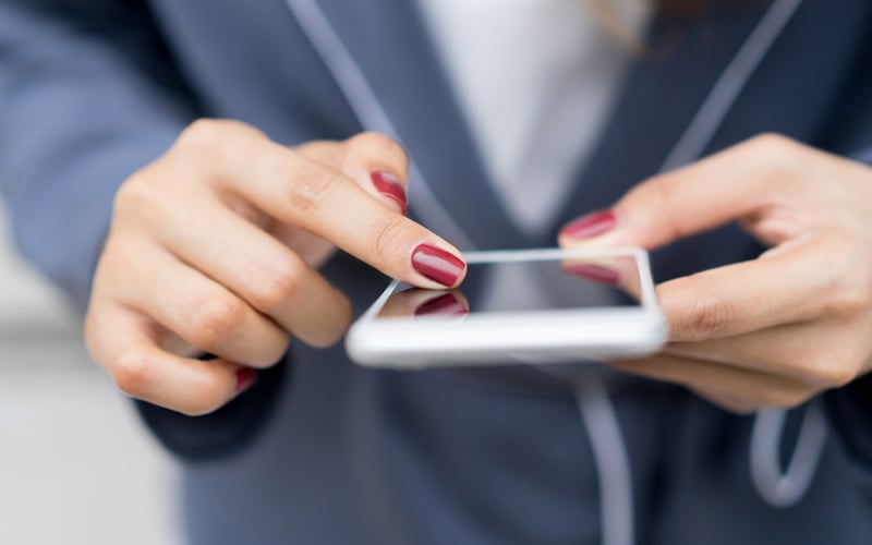 Hands using a smartphone