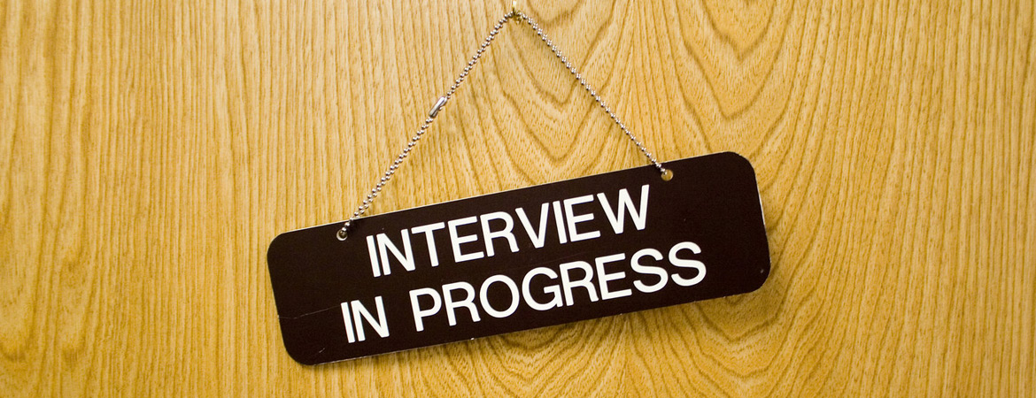 Interview in Progress sign hanging on door