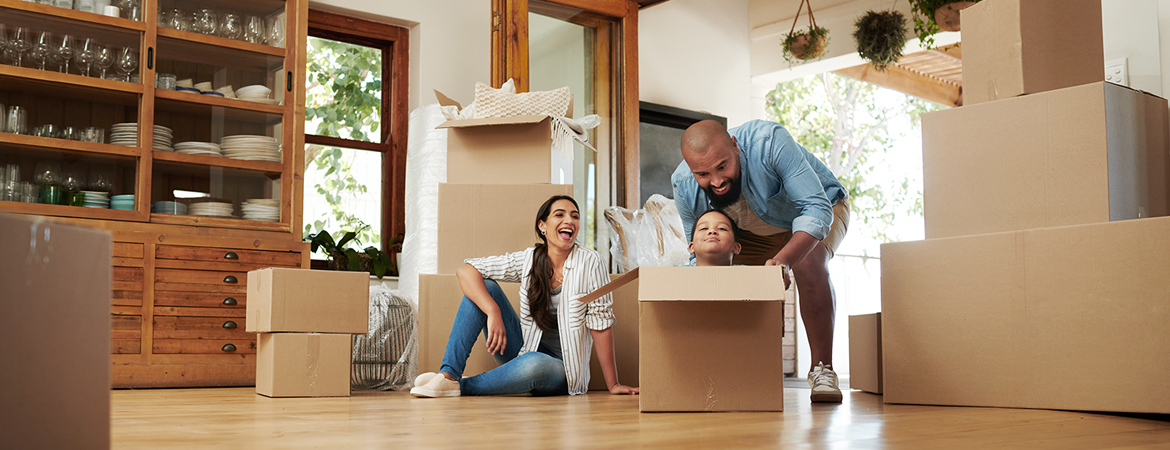 Family in home with moving boxes